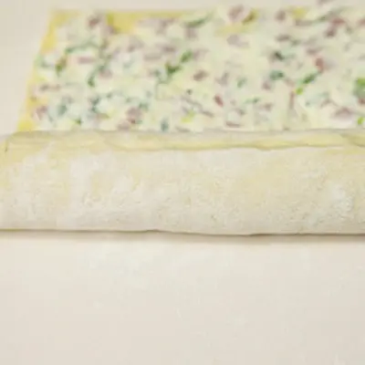 preparing the crust for an appetizer recipe with puff pastry