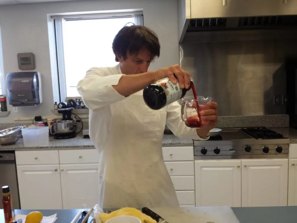 Carefully measuring out the ingredients