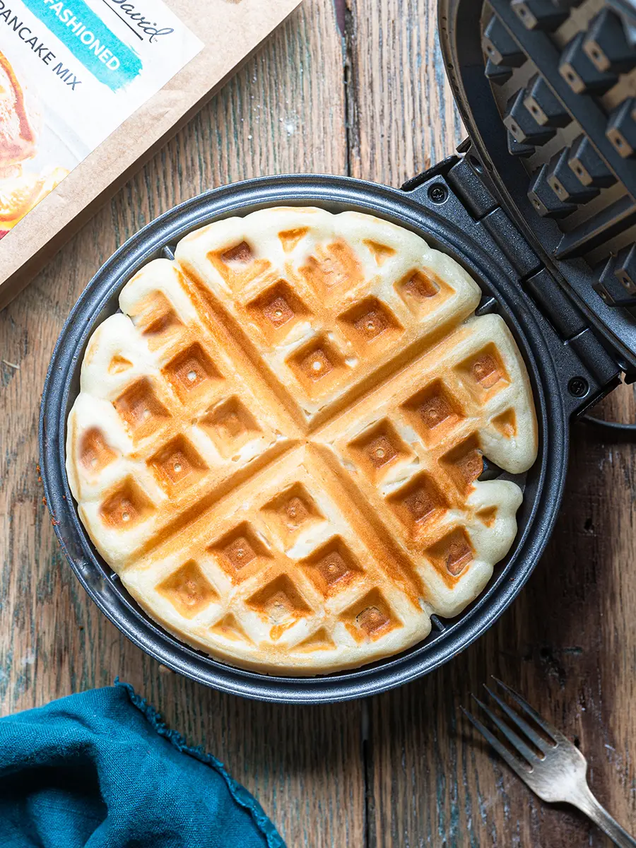 How to make waffles with pancakes mix with a cooked waffle in a waffle iron.