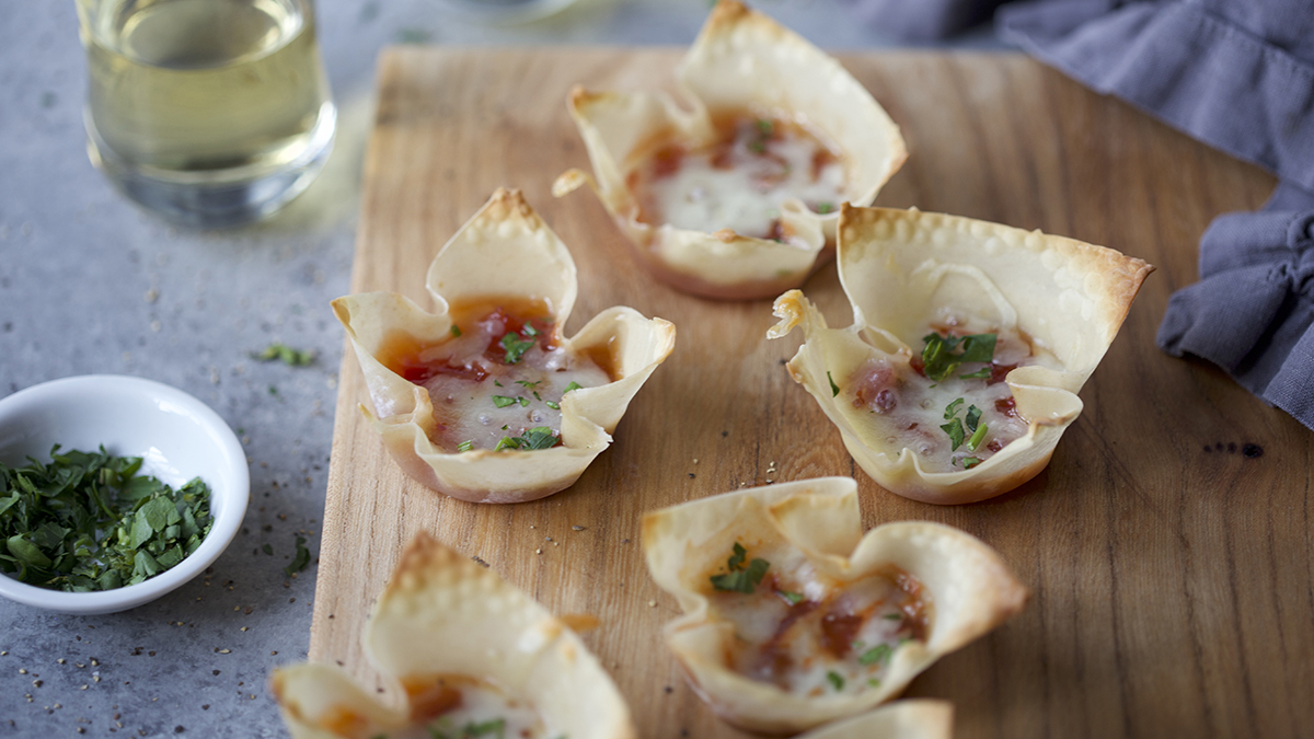 Wonton recipe with pepper & onion relish on a platter.