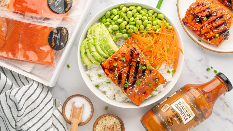Teriyaki salmon bowl surrounded by ingredients.
