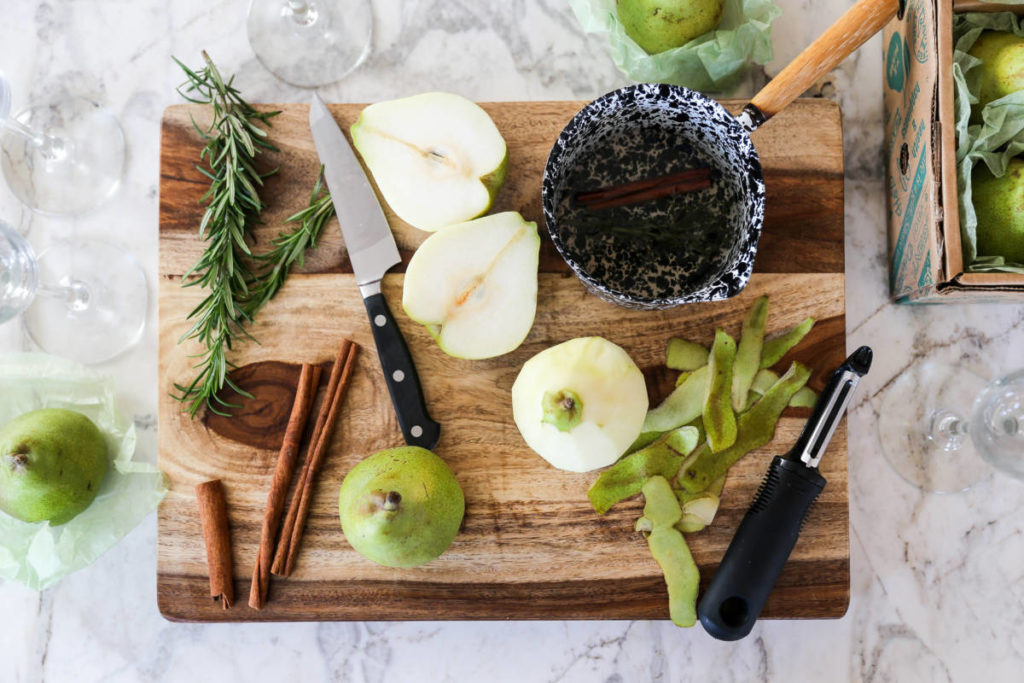 A photo of pear bellini and the process of making this cocktail with a cutting board full of chopped pears and herbs