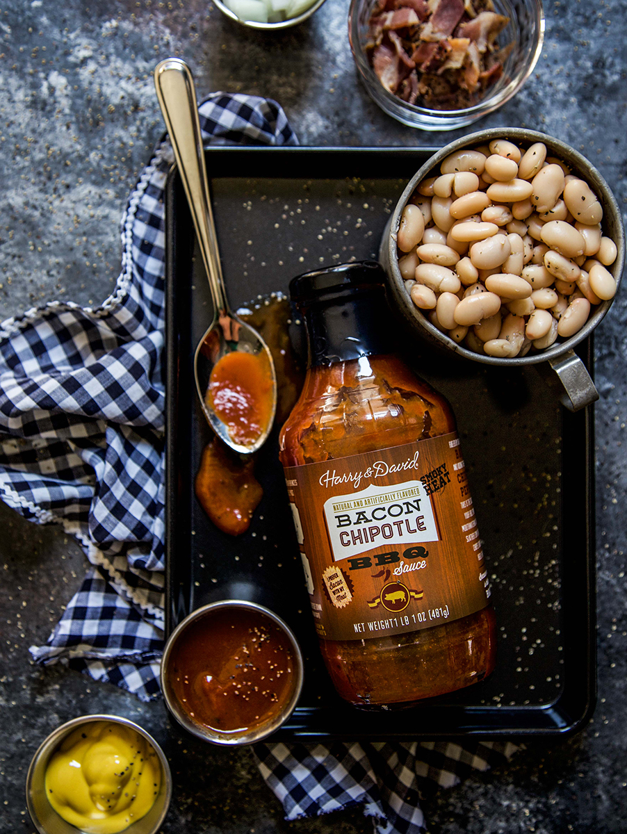 A photo of baked beans recipe with ingredients for baked beans on a counter.