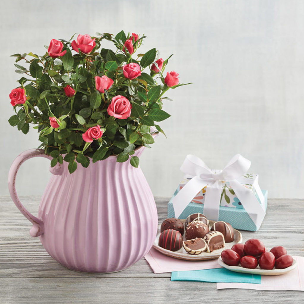 mini roses in pitcher for mother's day
