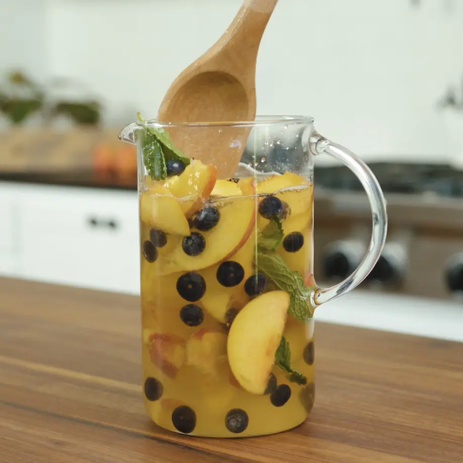peach sangria with blueberries and mint