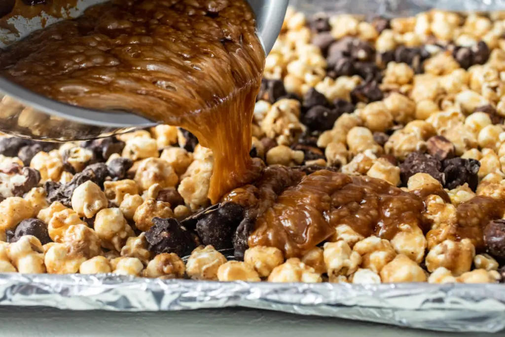 Halloween snack image - caramel being poured over moose munch