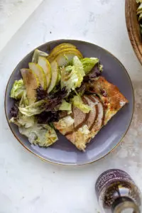 cooked pear pizza with greens salad