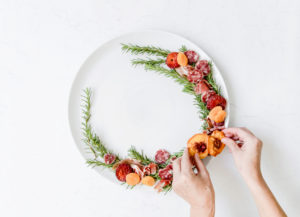 putting charcuterie on the holiday charcuterie wreath