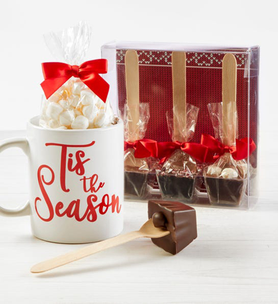 A photo of holiday gifts for him with a photo of belgian chocolate hot coco with marshmallows and chocolate spoons