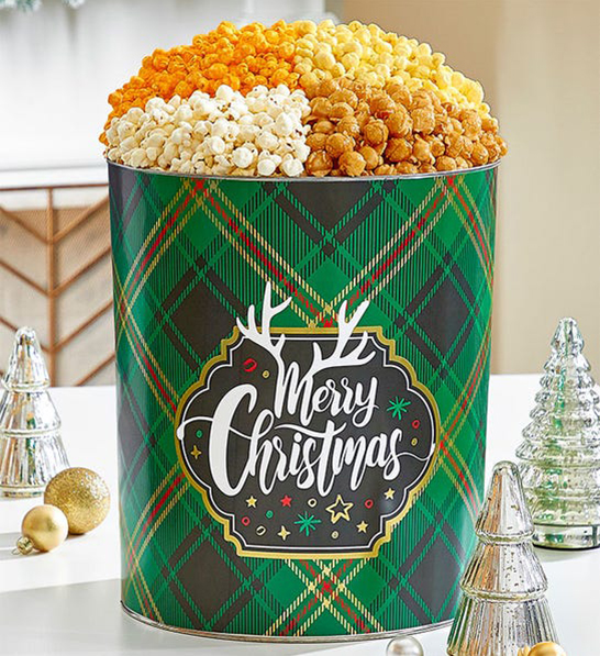 A photo of holiday gifts for him with a tin of popcorn