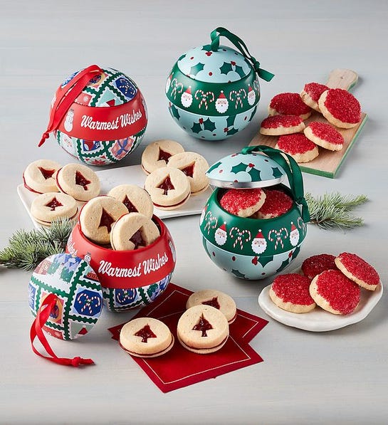 A photo of stocking stuffer ideas with ornaments that are full of cookies on a table.