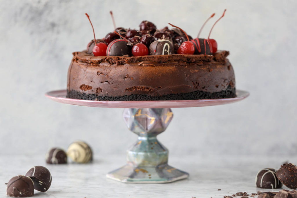 A photo of mother's day brunch ideas with a chocolate cherry cheesecake