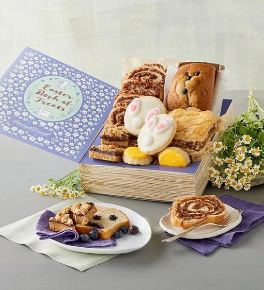 A photo of Easter gift ideas with a box full of baked goods and two plates carrying the same items in front.