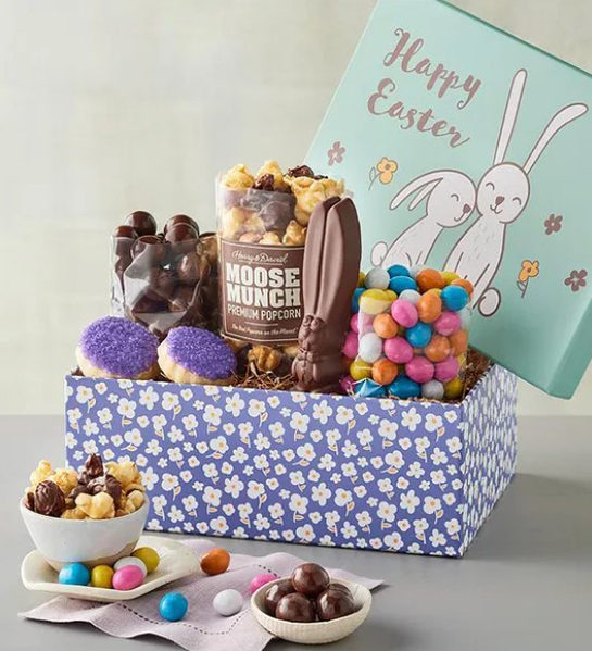 A photo of Easter gift ideas with a box full of Easter candy and Moose Munch and the same ingredients in bowls in front of the box.