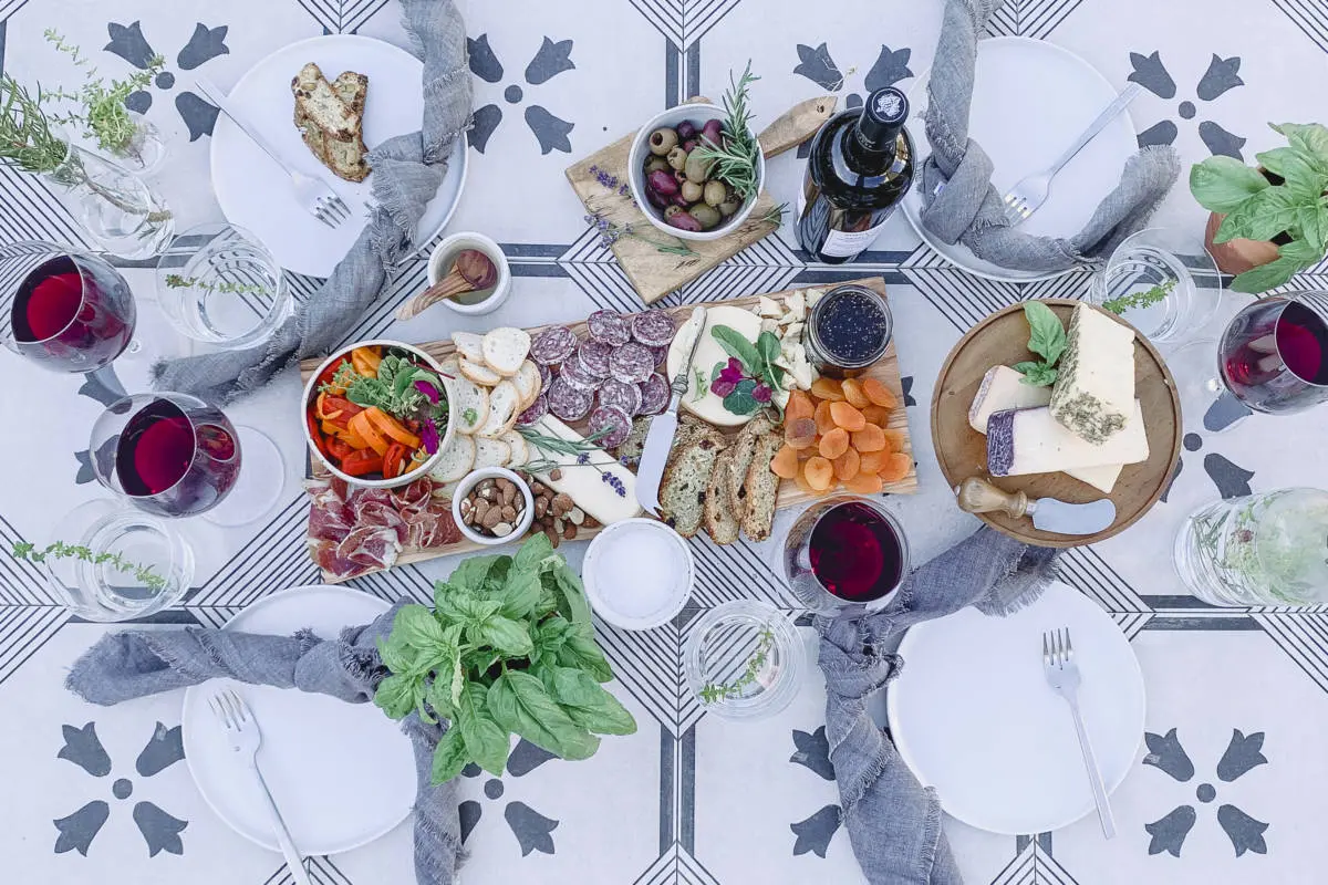 Italian backyard vacation with cheese, charcuterie, and wine