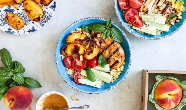 summer bowl with honey lime chicken and grilled peaches