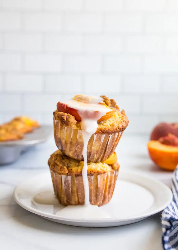 peach muffins with creamy vanilla drizzle
