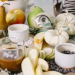 Halloween Snack Board with Caramel Apples, Pears, and Cheesecake