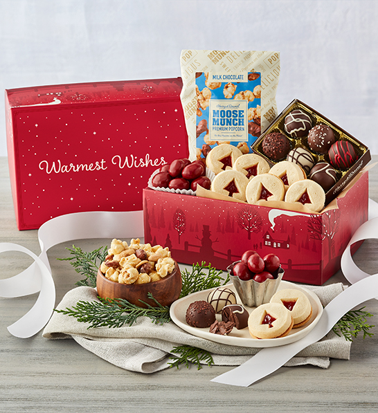 A photo of Christmas gifts under $30 with a red box full of cookies, truffles, and moose munch