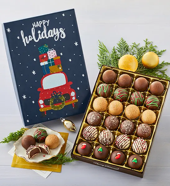 A photo of a gift guide with an open box of truffles and a plate of four of the same truffles next to it.