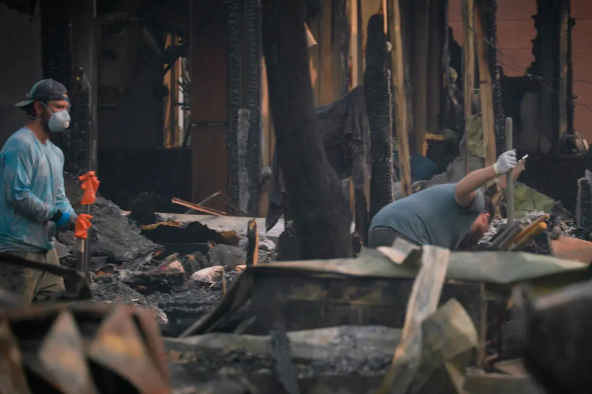 cleaning up the wreckage after almeda fire