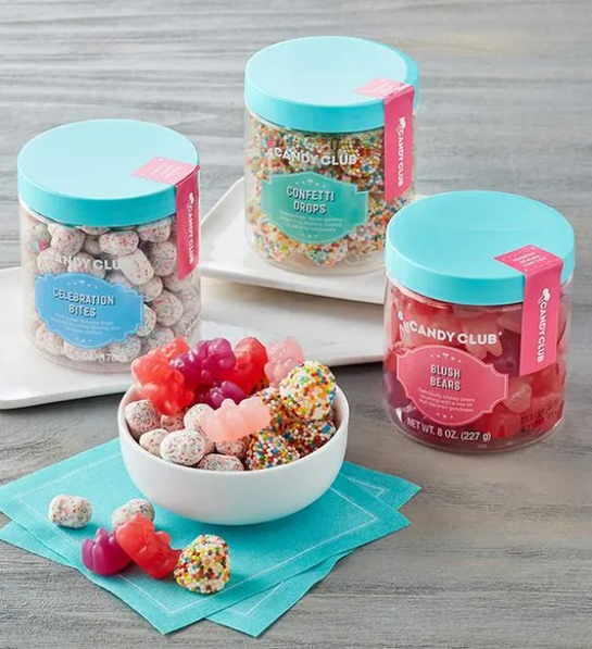 A photo of Easter candy with three jars of candy and a bowl full of candy next to them.