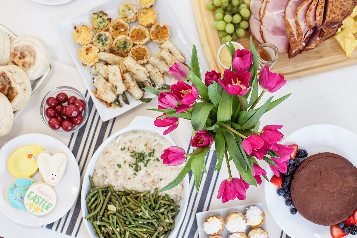 A photo of Easter meal with a spread of Easter brunch items.