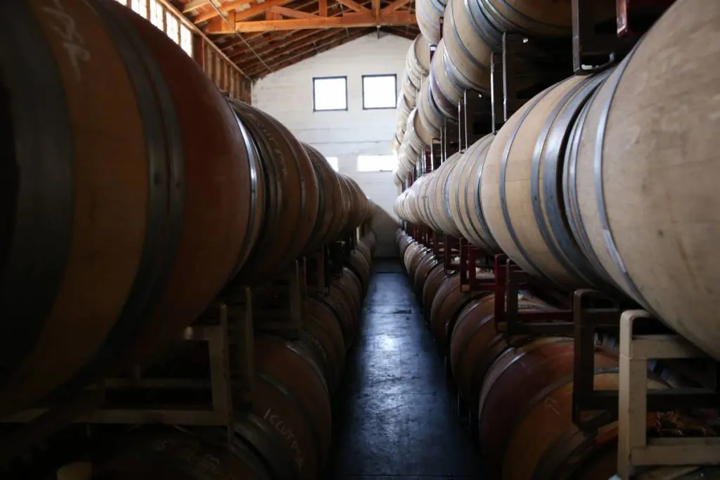 Oregon wine barrels in a barn.