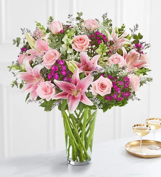 Last minute gift ideas for mom with a bouquet of purple and pink flowers in a glass vase.
