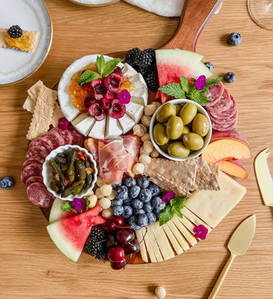 Last minute gift ideas for mom with a charcuterie, cheese, and fruit board.