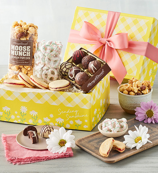 Mother's Day gift ideas with a colorful gift box full of Moose Munch, yogurt covered pretzels, truffles and more snacks.