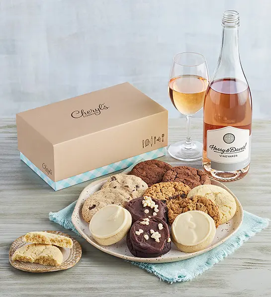 Mother's Day gift ideas with a plate of cookies next to a bottle and glass of rosé wine.