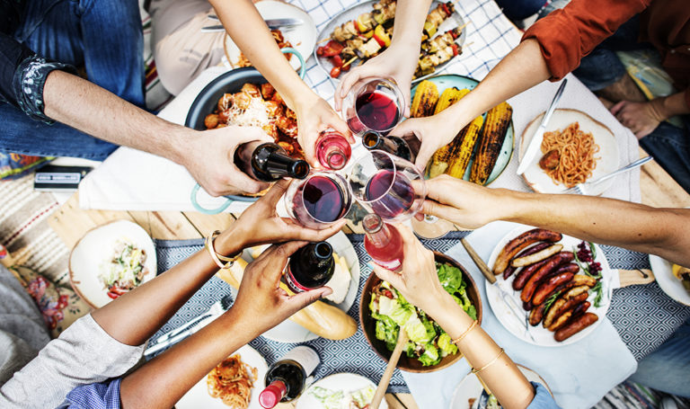 Wine glasses toasting