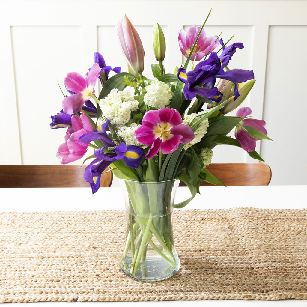 A photo of a flower bouquet arranged in a vase. 