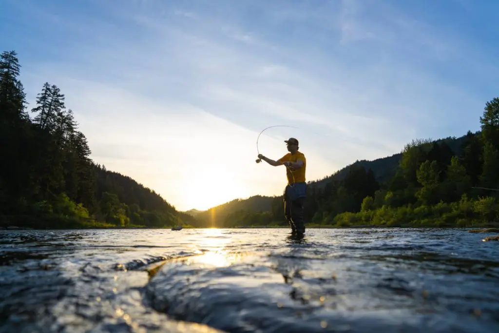 Father's Day trips with a man fly fishing in a river.