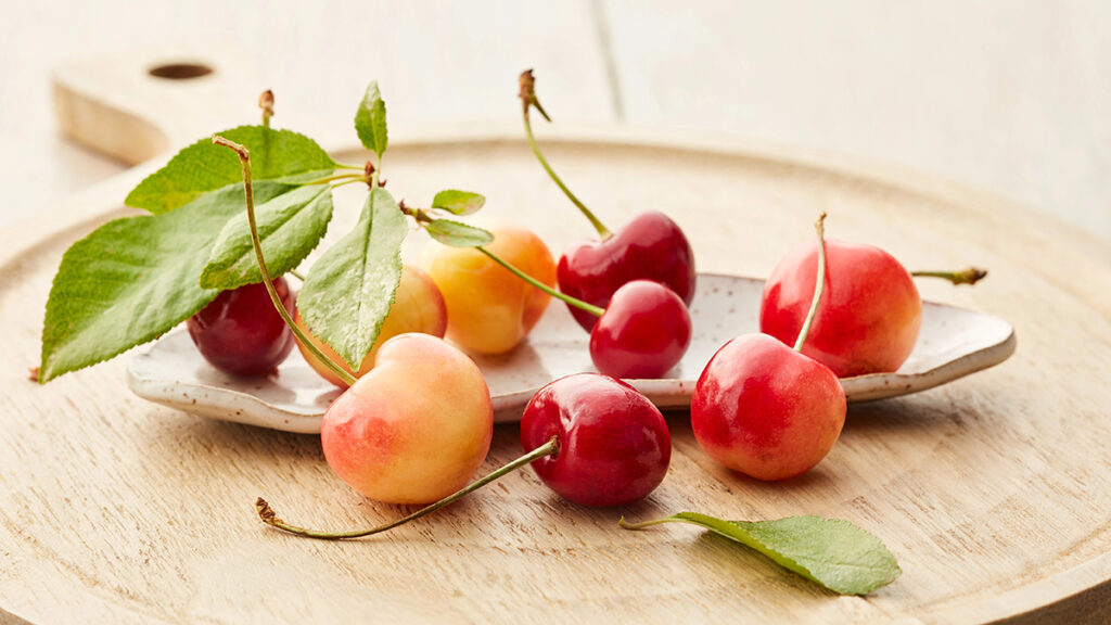 Cherry facts with several cherries on a platter.