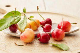 Cherry facts with several cherries on a platter.