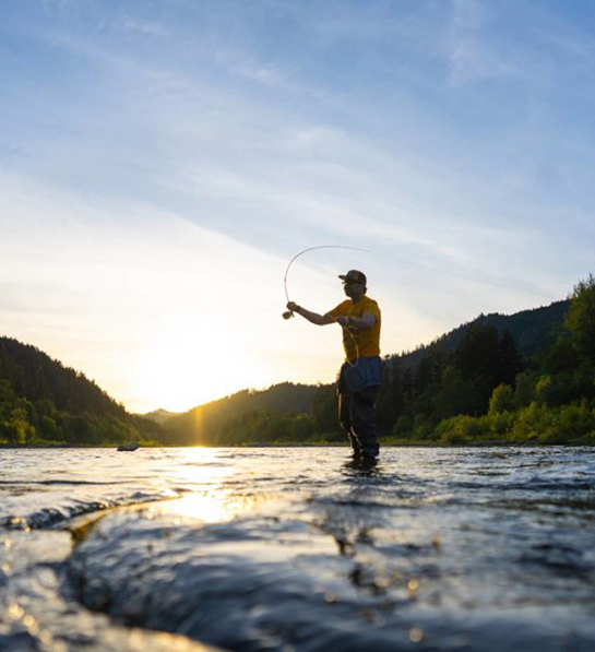 Last-minute Father's Day gift ideas with someone fishing in a river.