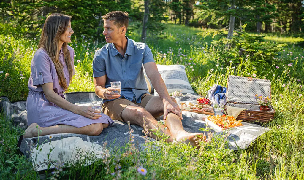 Photo of make the most of summer  couple having a picnic.
