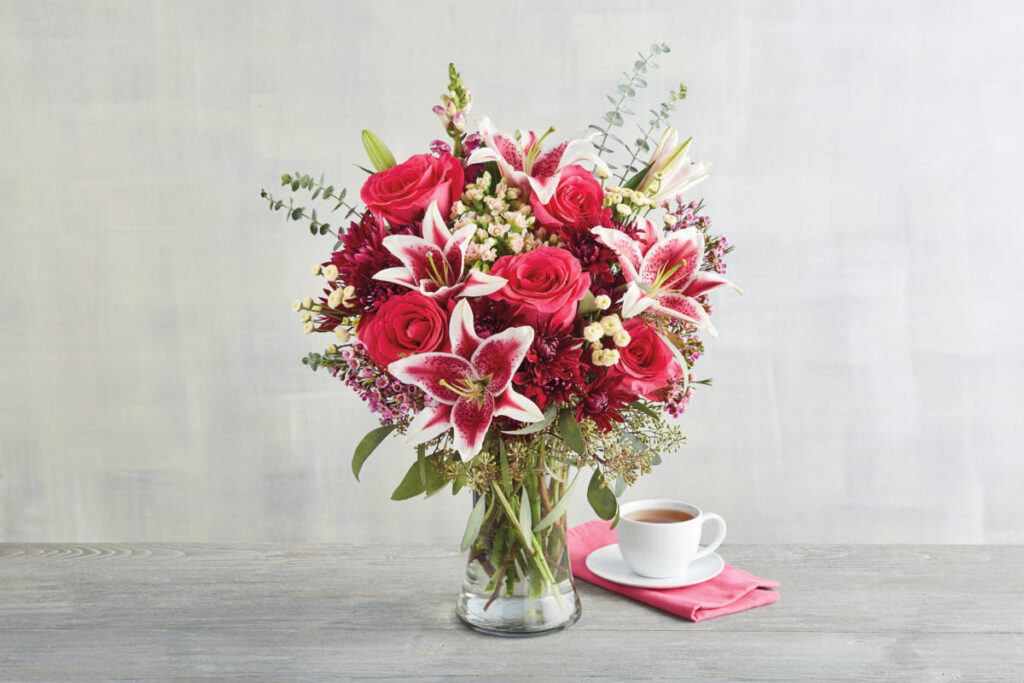 college care package ideas image -- flowers University care package with pink flowers in a bouquet.