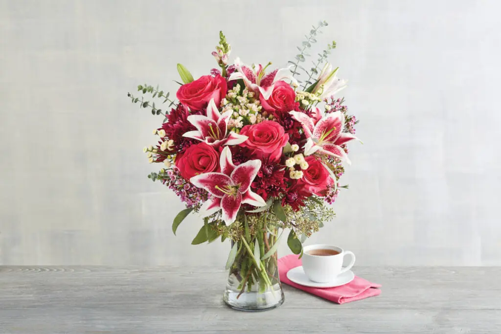 University care package with pink flowers in a bouquet.