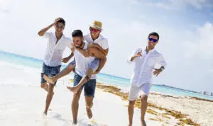 bachelor party image -- group of young men on a beach