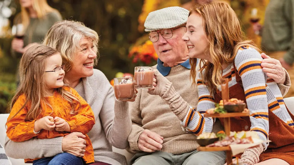 Grandparents day image - grandparents and grandchildren drinking hot chocolate outside