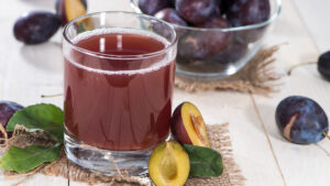 Facts about plums image - plum juice in a glass