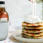 Confetti pancakes image - confetti pancakes with candles and whipped cream