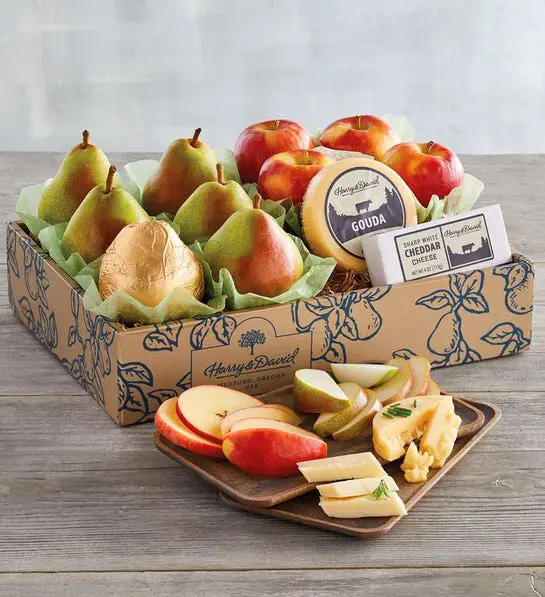 University care package with a box full of apples, pears and cheese.