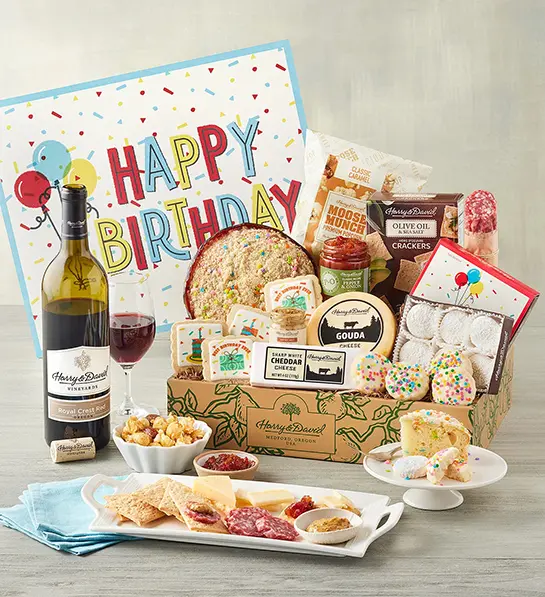 Favorite birthday gifts in a box with wine and a happy birthday message.