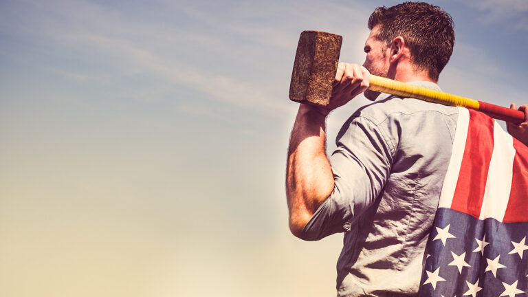 labor day facts image -- guy holding a sledgehammer