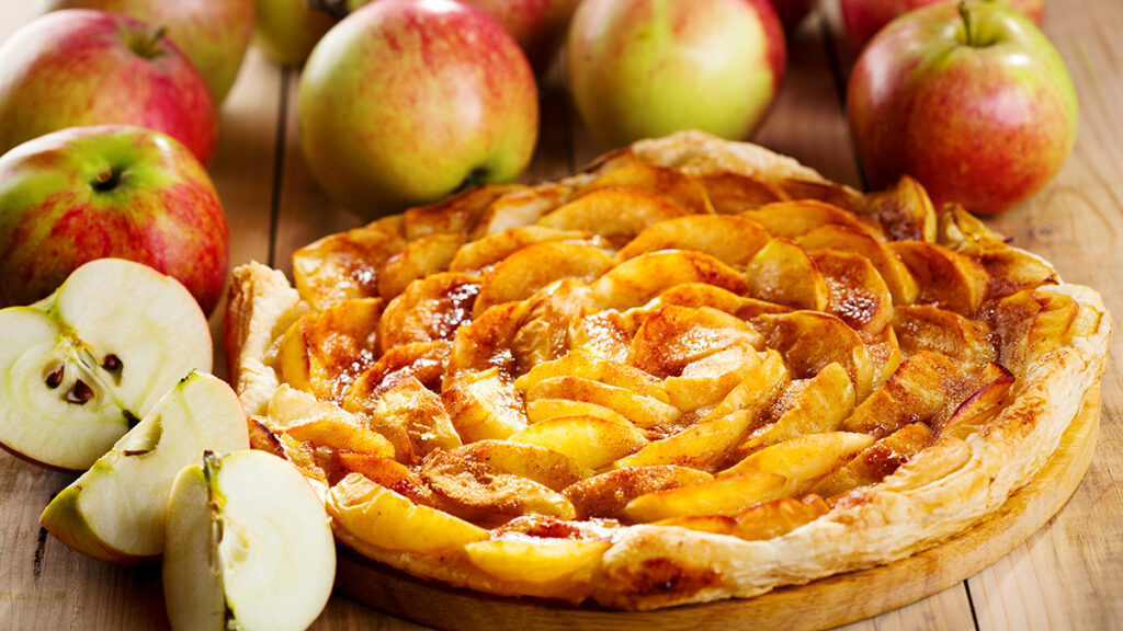 Apple image - apple pie with fresh fruits on wooden table