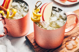 Moscow mule recipe image - moscow mule cocktail with apples, lemon twist and cinnamon